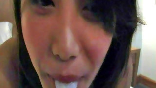 Horny Asian teen swallowing a load of cum