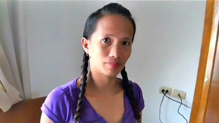 Asian woman with braids strips her clothes
