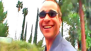 Pretty bloke wearing sunglasses showing his nice smile