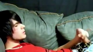 Delicious dark haired guy wanks cock on couch
