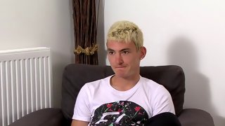 Guy with blond hair strokes his penis