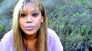 Sweet black tranny teasing cock in the woods in tranny porn